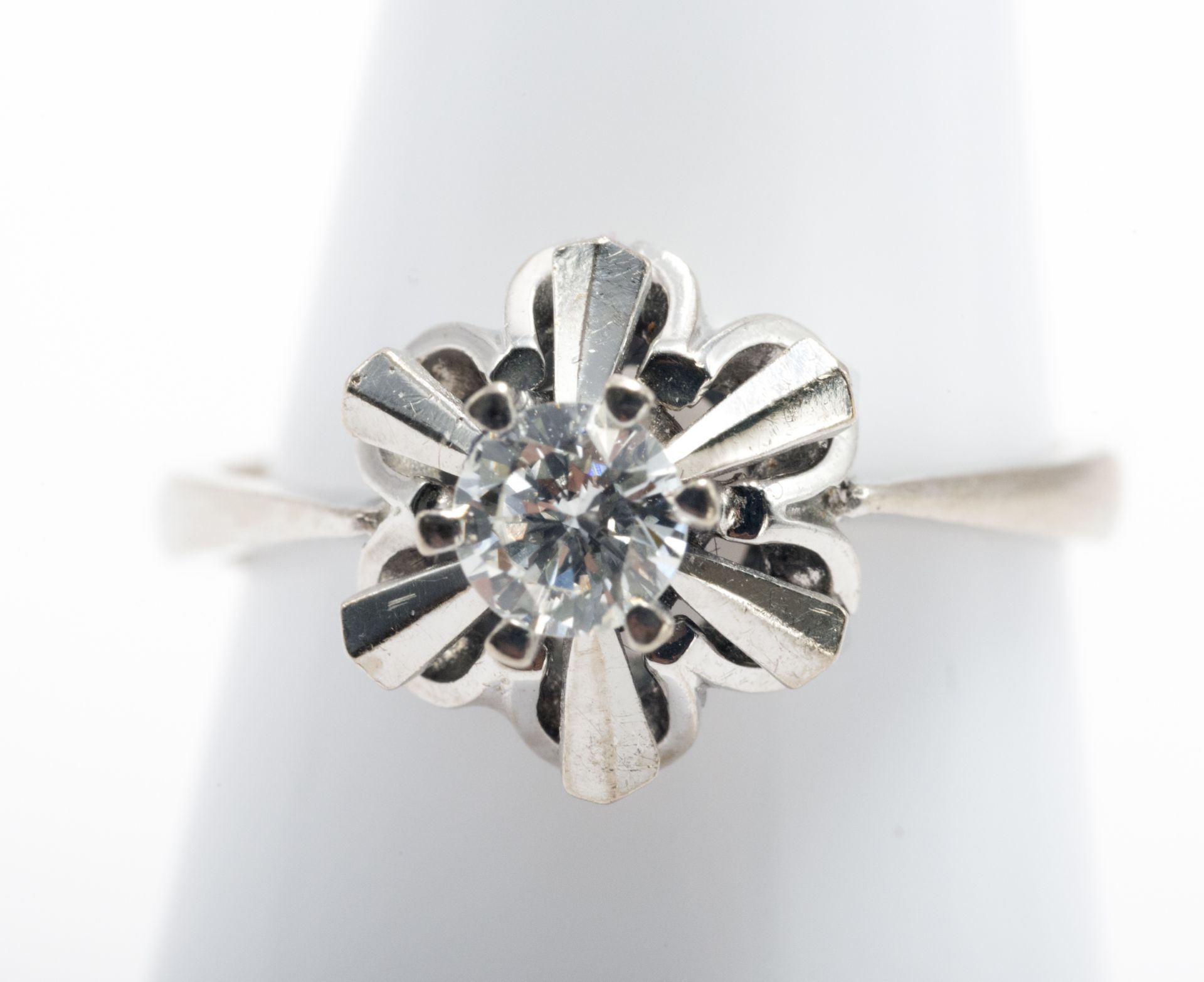 18 kt white gold solitaire with diamond.
