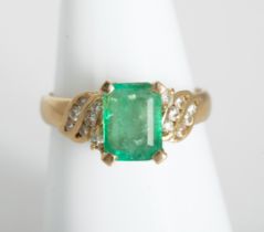 18kt gold emerald and diamond ring.