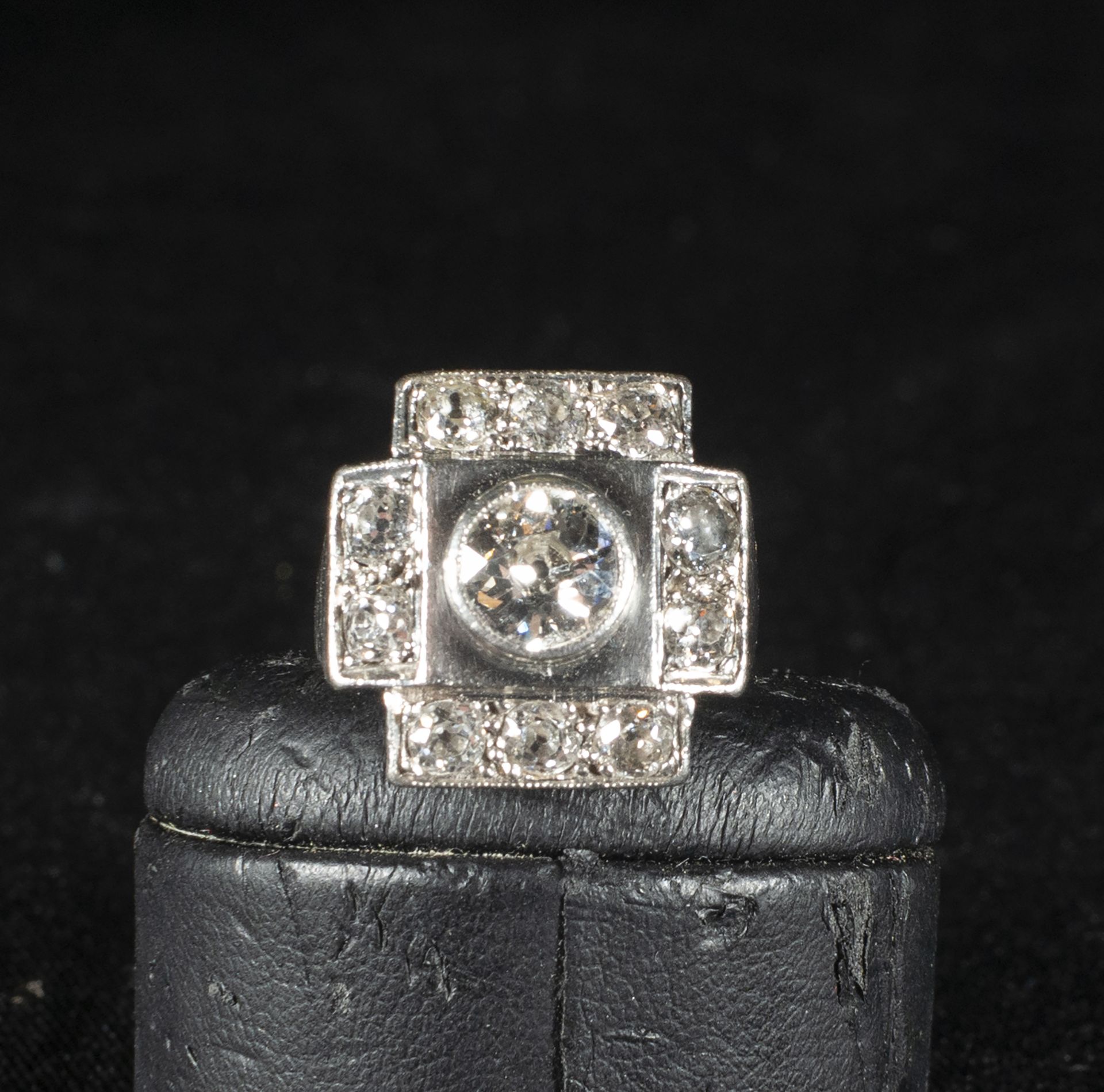 Distinguished Lady's solitaire with a large 1ct central diamond and a 1.2ct border