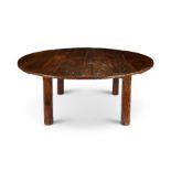 A large circular reclaimed oak dining table