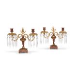 A pair of George IV glass, gilt-metal and cold painted twin-light table candelabra