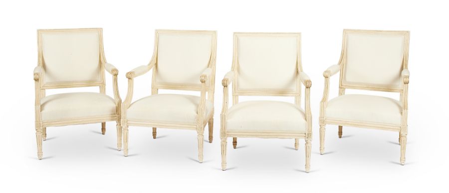 A set of four early 20th century Louis XVI style white painted fauteuils