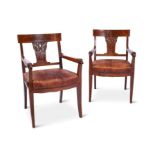A pair of early 20th century German walnut armchairs, circa 1910