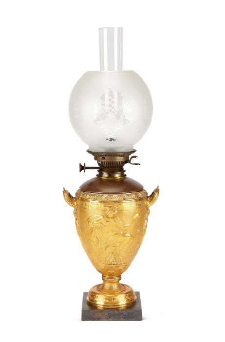 A 19th century patinated and gilt bronze oil lamp