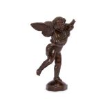 A 17th century Renaissance style bronze figure of a winged putti holding a fish