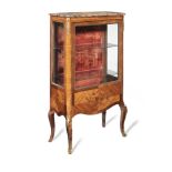 A late 19th century French kingwood and marquetry display cabinet