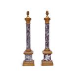A pair of 20th century gilt metal and simulated marble corinthian column table lamps