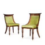 A pair of Regency mahogany bergere side chairs in the manner of Gillows