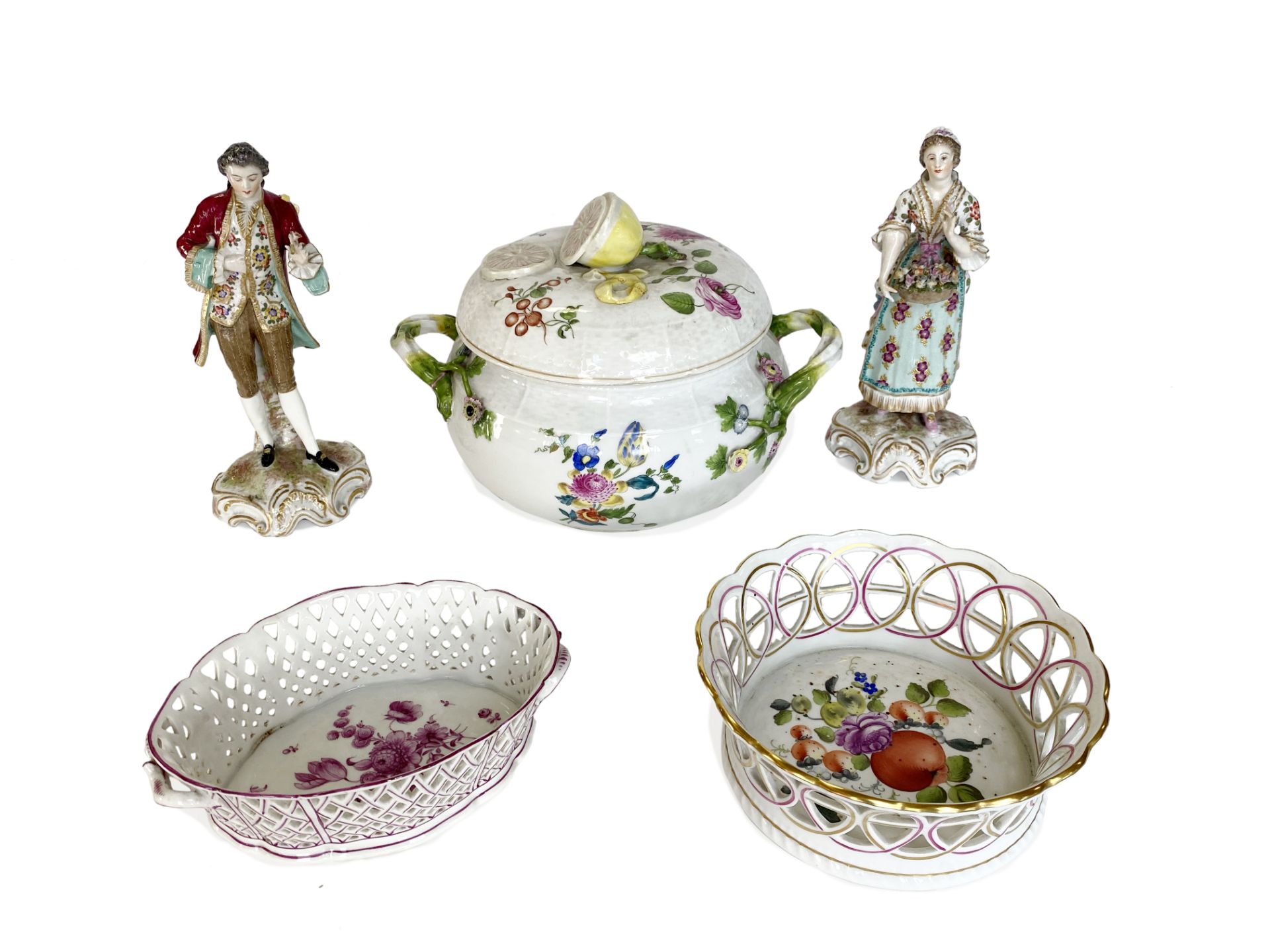 A 19th century Nymphenberg tureen, two other continental porcelain dishes and a pair of figures