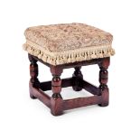 A Charles II carved oak and upholstered child's stool
