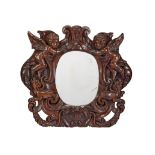 A 17th century Dutch Renaissance style oak carved frame with later mirror plate