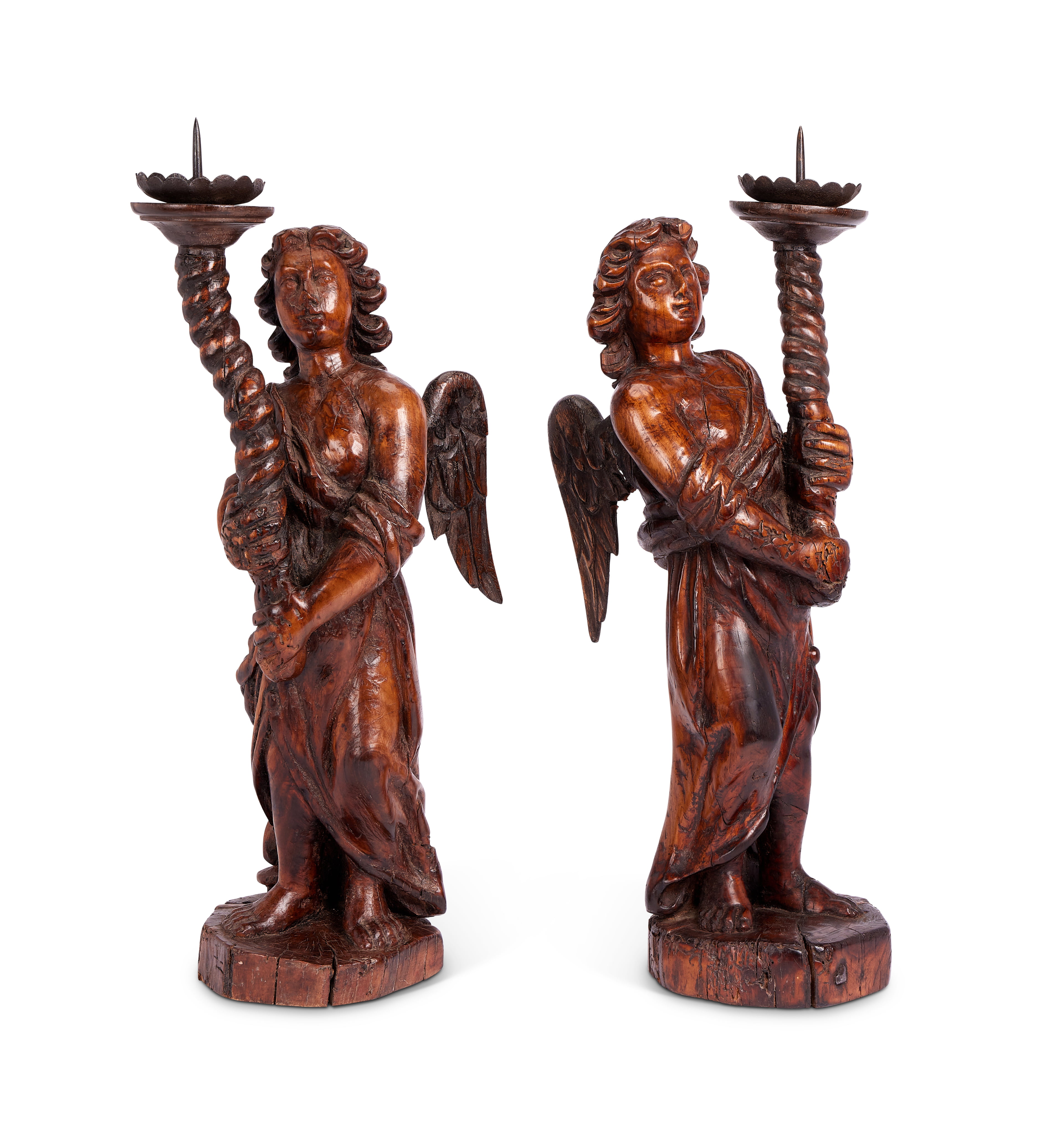 A pair of 17th century Flemish carved walnut pricket candlesticks
