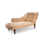 An unusual mid Victorian mahogany chaise long with a reversible arm
