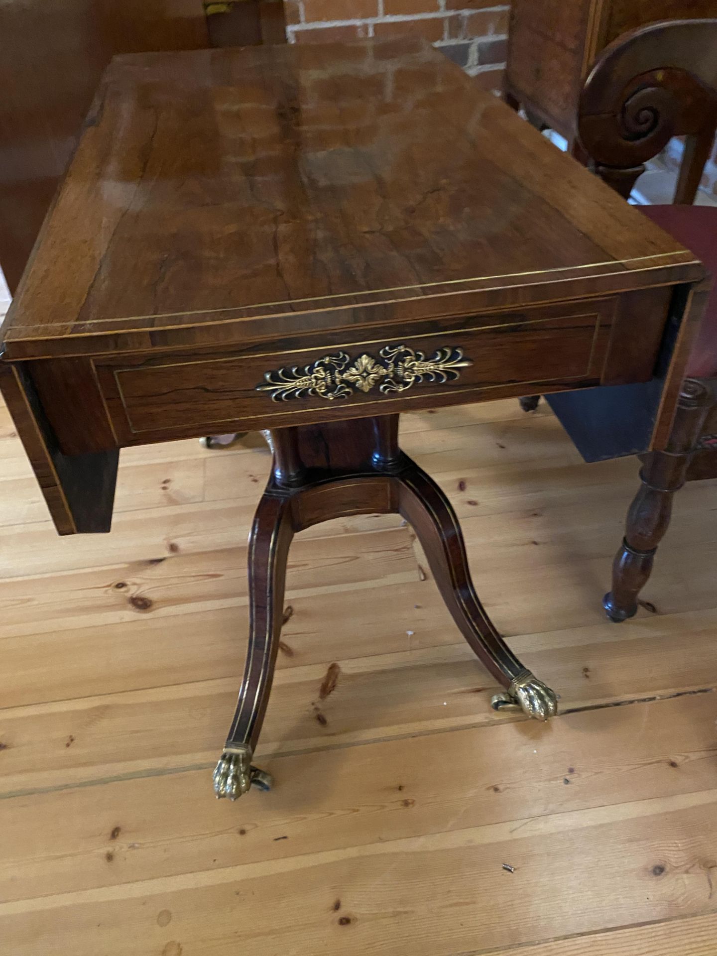 A Regency rosewood and brass inlaid drop leaf table - Image 6 of 11