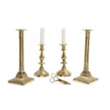 A pair of tall George III brass candlesticks and other brass ware