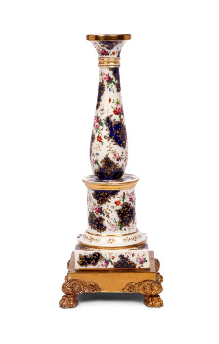 A 19th century French porcelain column on a gilt bronze base