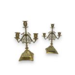 A pair of late 19th century Aesthetic period brass three light candleabra in the manner of Christoph
