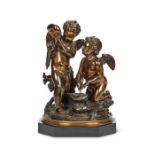 A 19th century French patinated bronze figural group of a pair of winged putti in the manner of Clod
