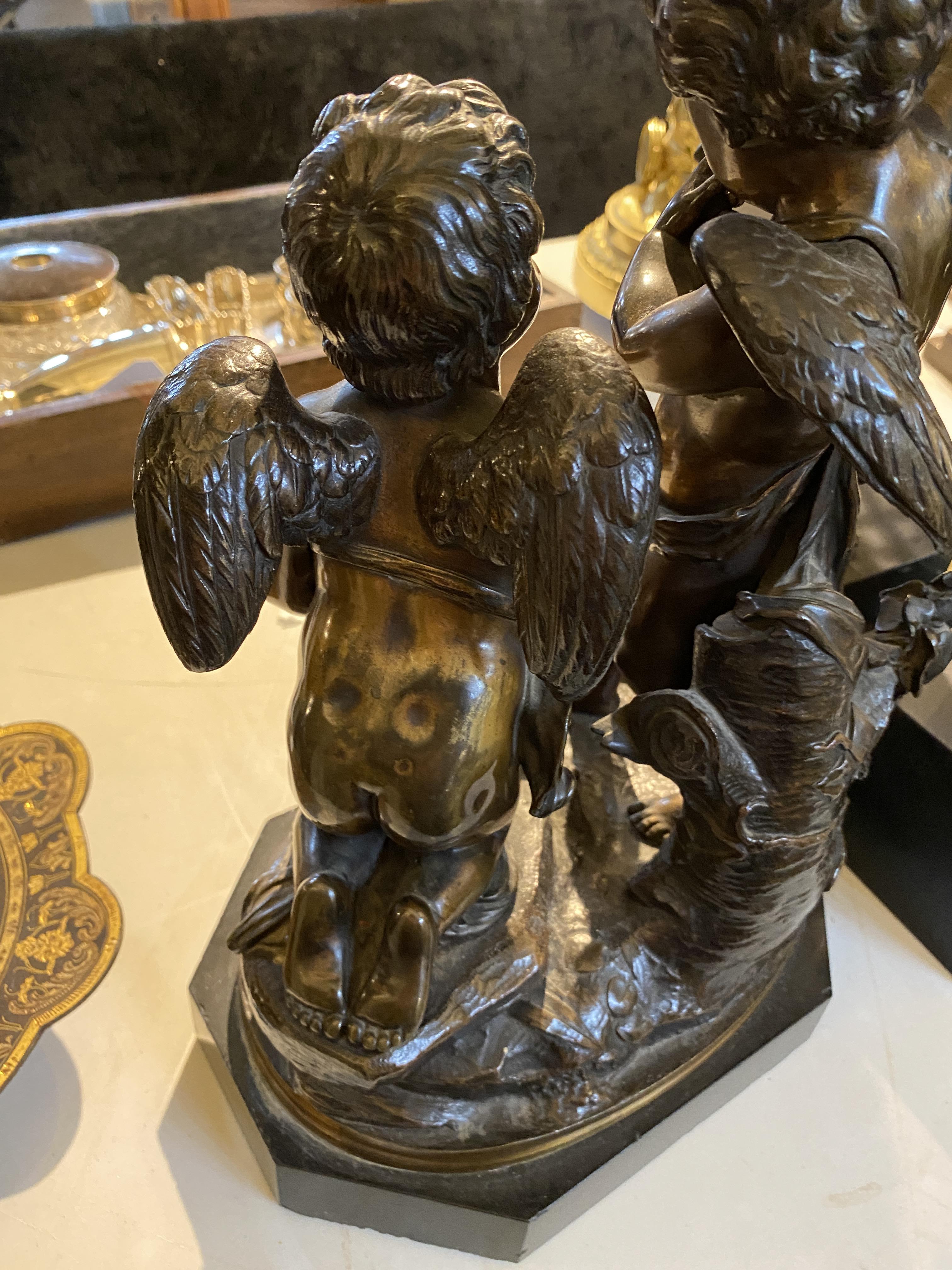 A 19th century French patinated bronze figural group of a pair of winged putti in the manner of Clod - Image 8 of 9