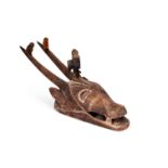 A West African Ivory Coast carved wooden Guro mask in the form of an antelope with birds