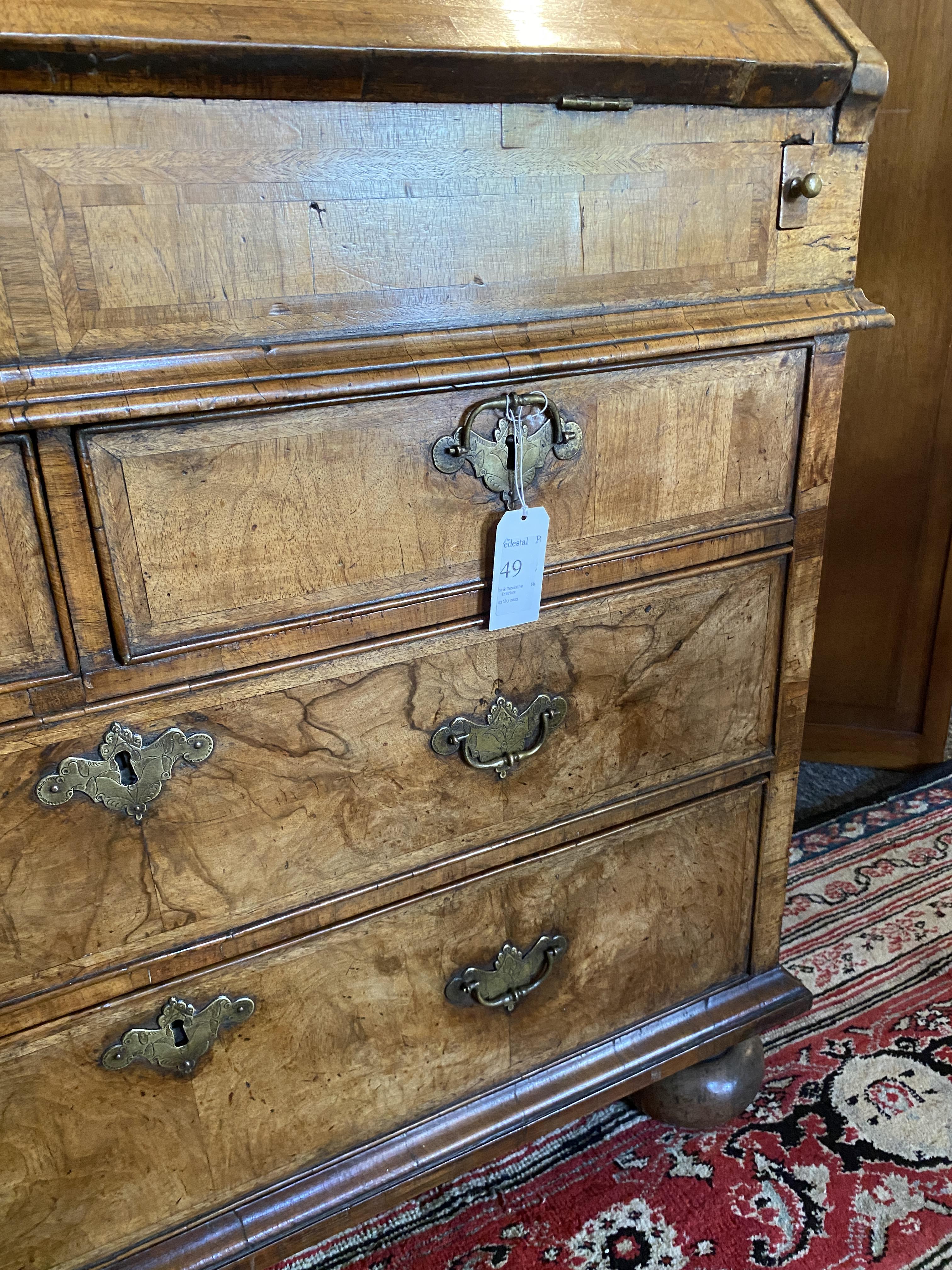 A George II walnut and featherbanded bureau - Image 10 of 33