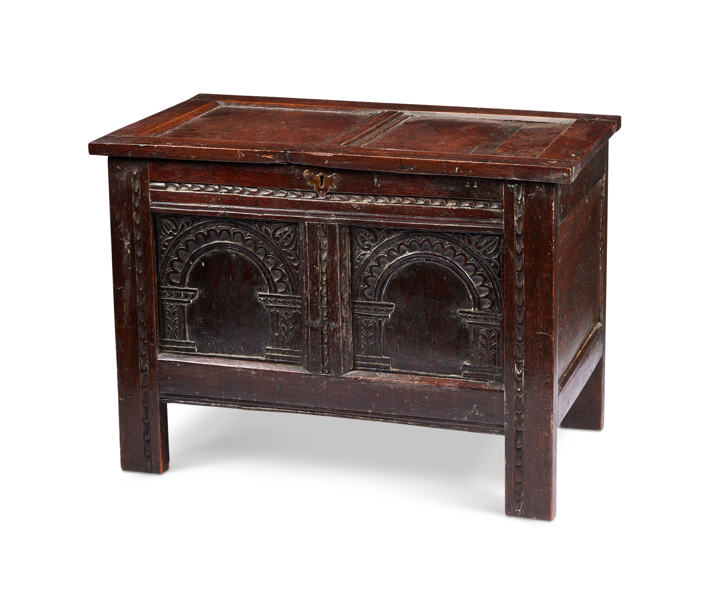 A small late 17th century oak carved chest