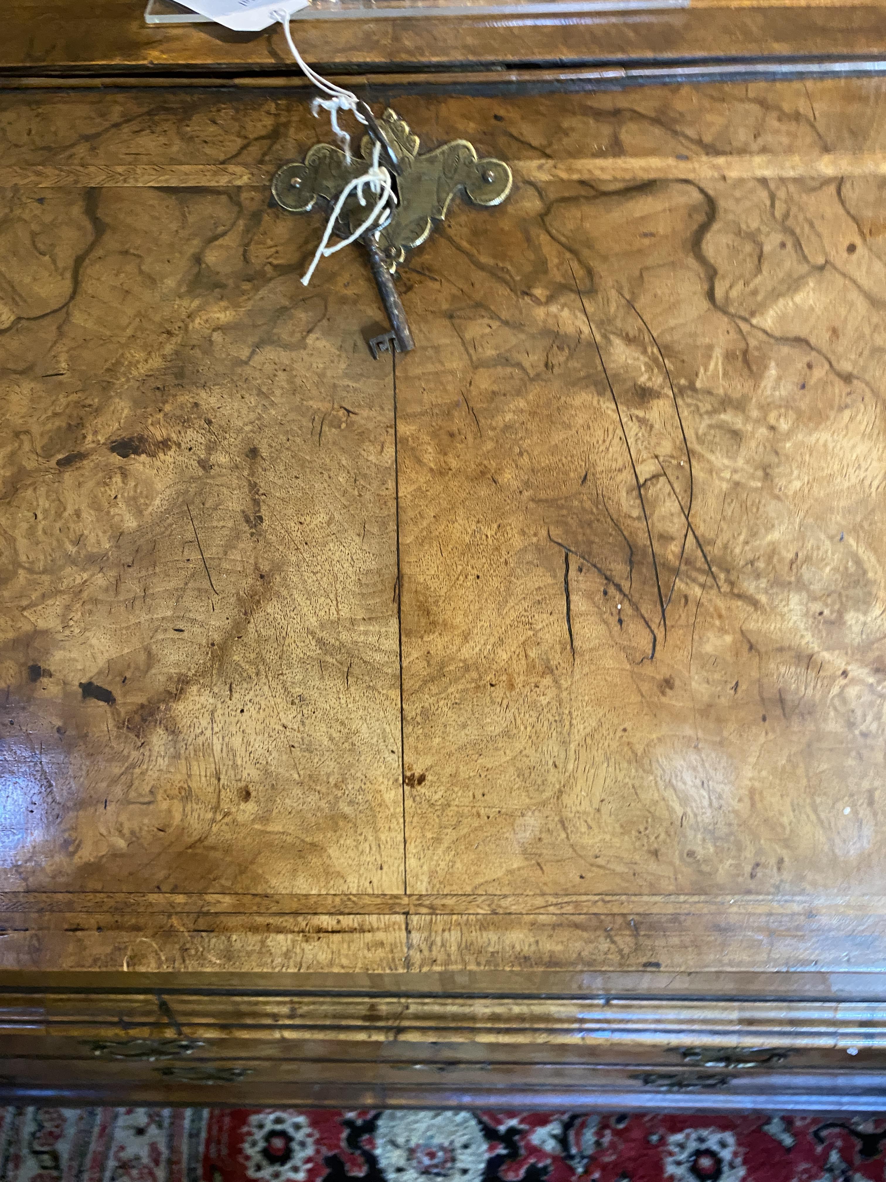 A George II walnut and featherbanded bureau - Image 5 of 33