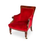 A George IV mahogany upholstered library armchair