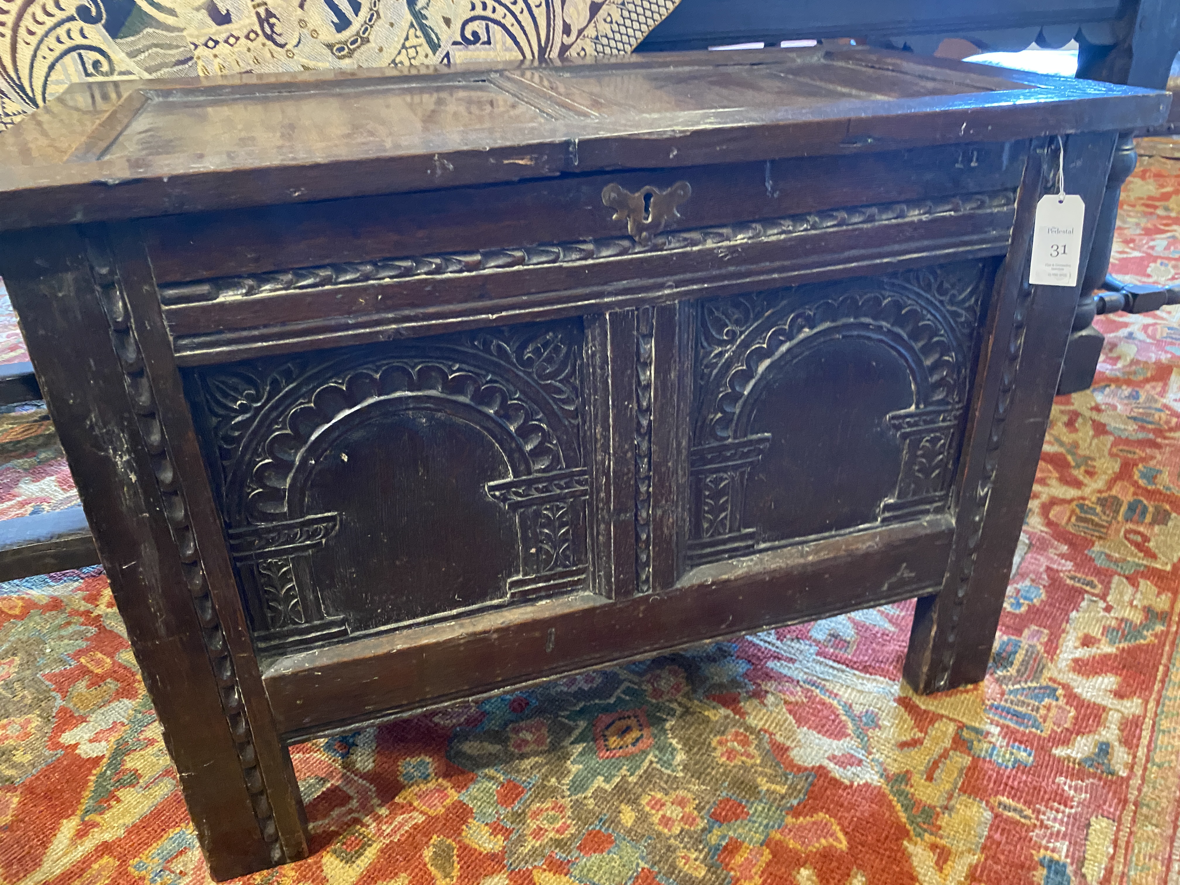 A small late 17th century oak carved chest - Image 11 of 12