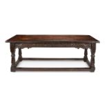 A 19th century oak carved refectory table in the 17th century style