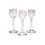 A set of three George III facet cut gilded wine or cordial glasses, circa 1780