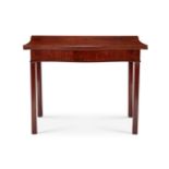 A George III mahogany serpentine tea table