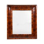 A William & Mary walnut oyster veneered cushion framed mirror