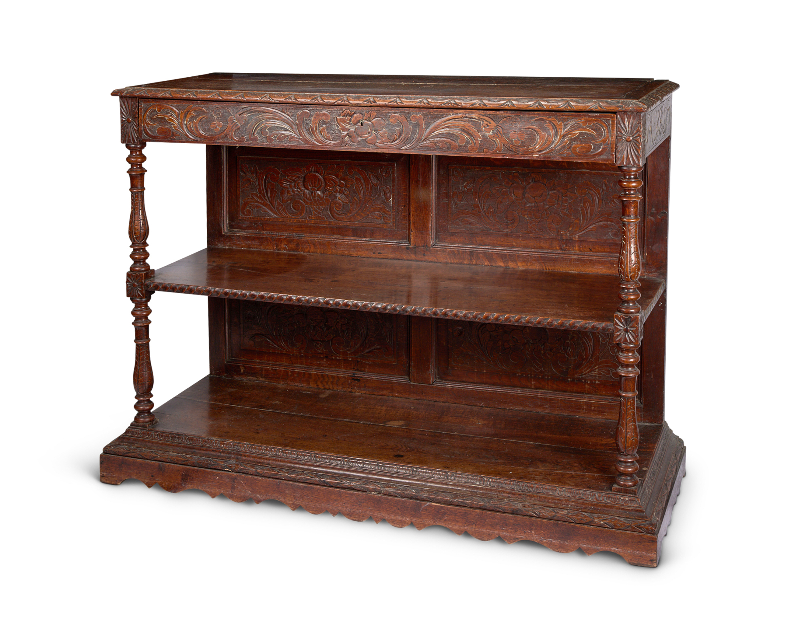 A 19th century carved oak two-tier buffet in the 17th century style