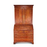 A George III oak and mahogany banded bureau cabinet