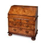 A George II walnut and featherbanded bureau