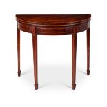 A George III mahogany and tulipwood crossbanded demi-lune card table