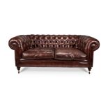 A contemporary brown leather and close-nailed two-seater Chesterfield sofa by The Original Sofa Co.