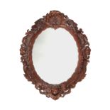 An 18th century oak carved mirror, possibly Irish