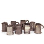 Eight 19th century pewter pint handled tankards