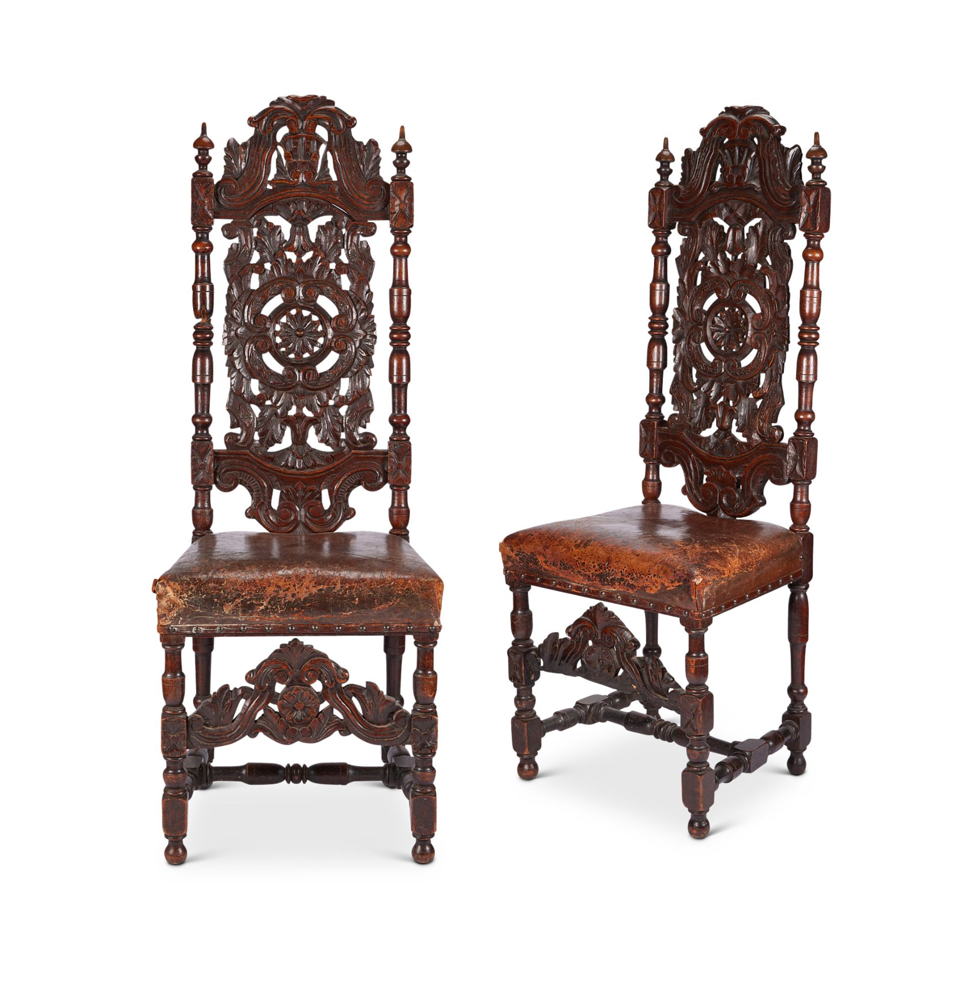 A pair of 19th century carved oak high back chairs in the Marot style