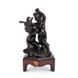An 18th century Louis XVI French patinated bronze group of a pair of putti with a bird of prey