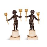 A pair of 19th century gilt bronze and patinated bronze putti candelabra