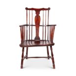 An early 19th century yew wood Windsor armchair