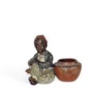 A small cold-painted bronze figure of a boy attributed to Bergmann