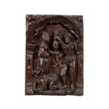 An early 17th century carved oak panel depicting the beheading of John the Baptist
