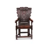 A 17th century oak carved wainscot chair