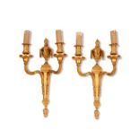 A pair of Louis XVI ormolu twin-light wall lights