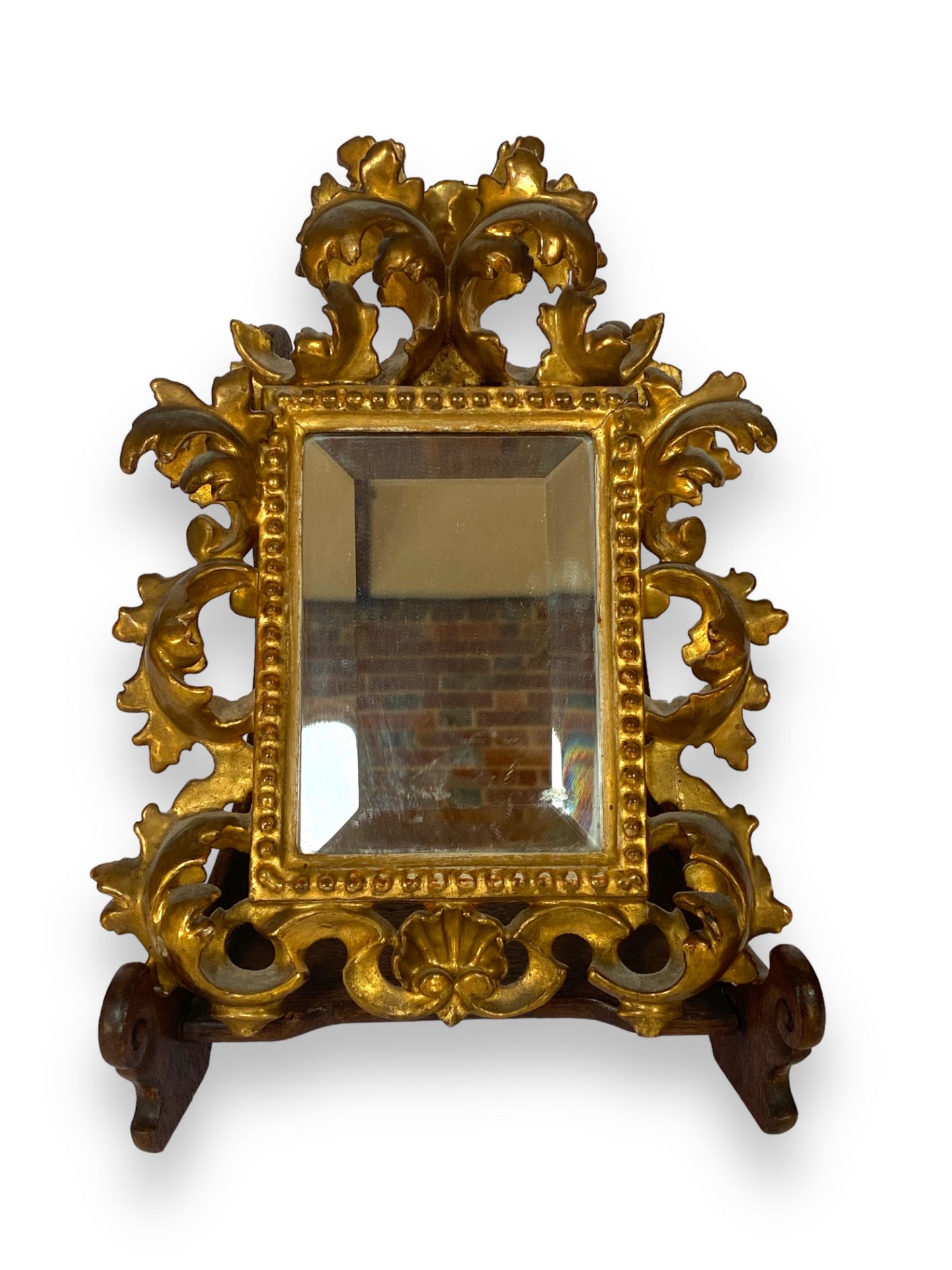 A small late 19th century Florentine carved giltwood mirror