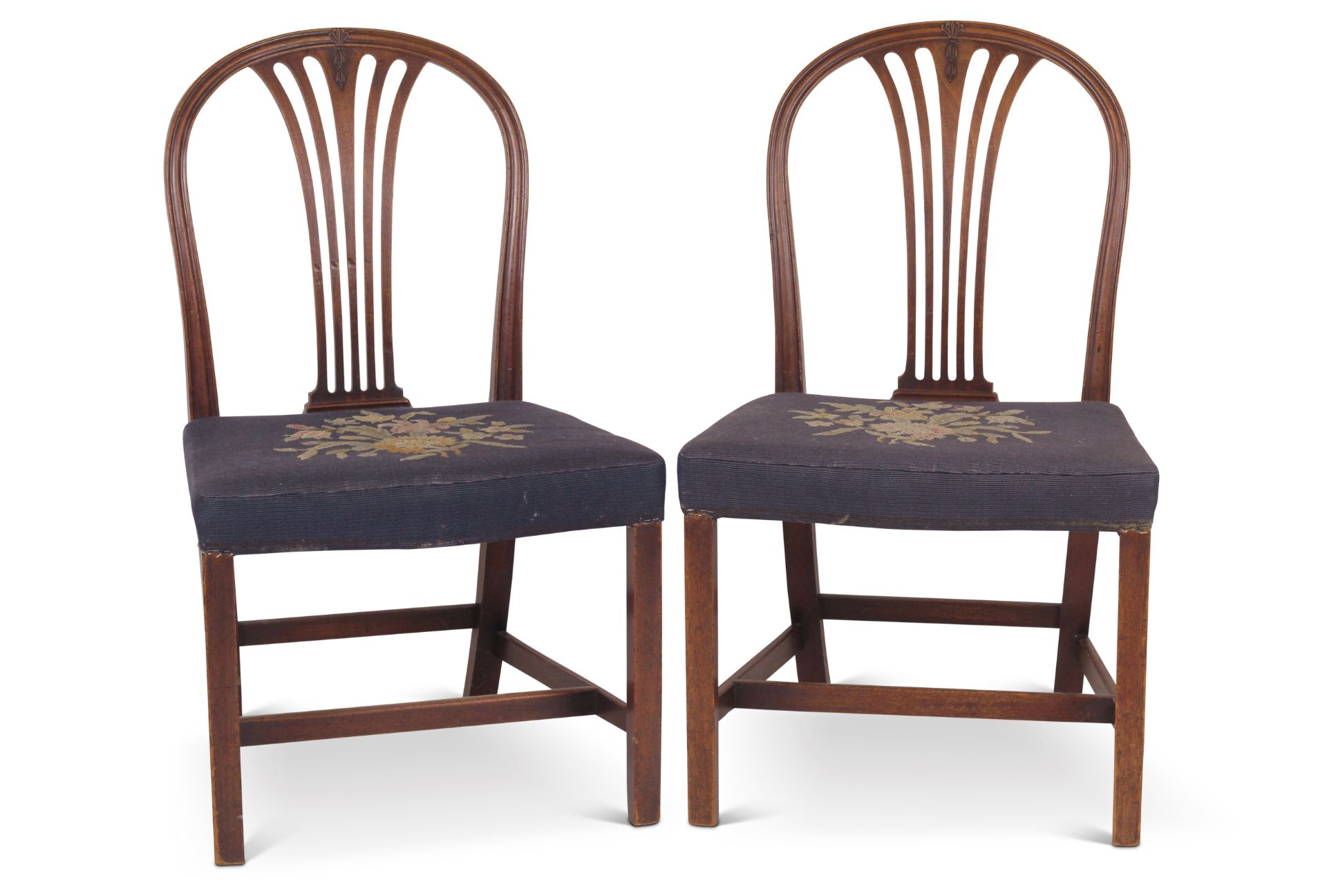 A pair of George III mahogany dining chairs in the Hepplewhite taste